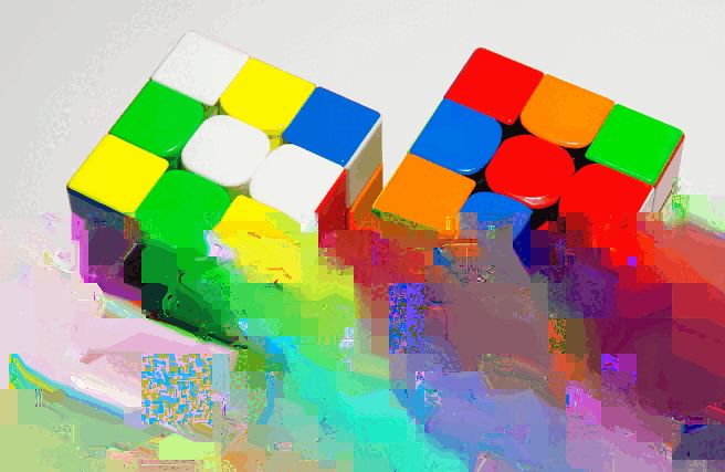 An corrupted image of two Rubik's Cubes